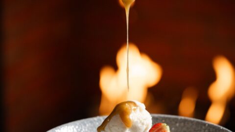 Indulge in rich brownie and ice cream with caramel sauce by the cosy fireplace at our hotel restaurant.